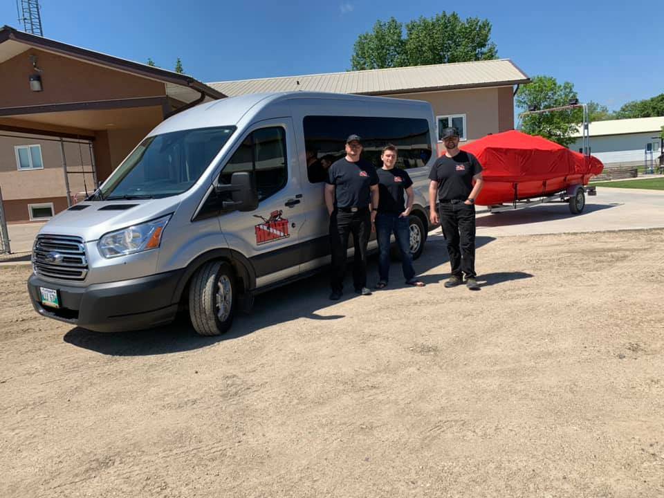 HEART team with the van and boat on a trailer