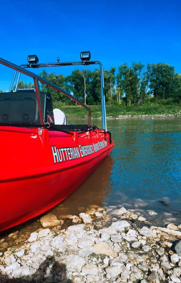 The red Whaly rescue boat on a river